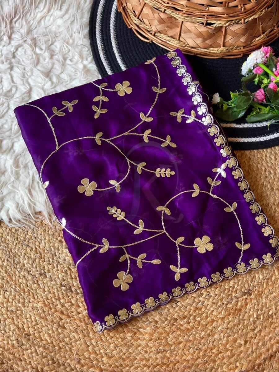 A vibrant purple moss chiffon saree featuring gold gota patti jaal work and a scalloped cutwork border.