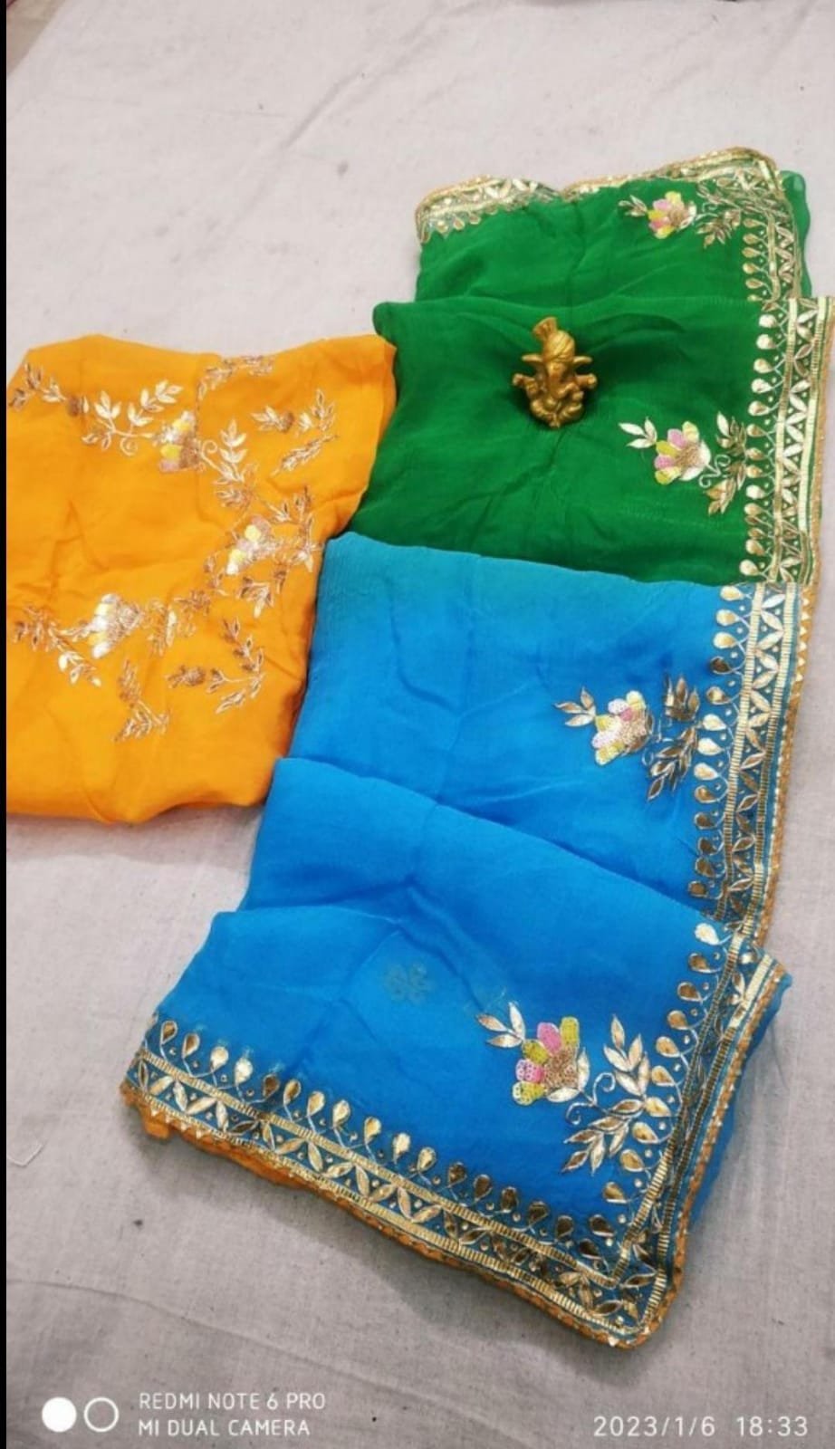 Organza Gota Patti Handwork Saree 2 A beautiful deep purple Organza saree with detailed gold Gota patti handwork and a contrasting bright blue blouse piece.