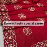 A red pure silk saree with heavy hand-worked Gota Patti borders, accompanied by handmade Kangan and a traditional Kamar Satka.
