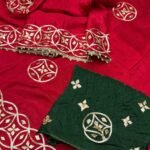 A red pure silk saree with heavy hand-worked Gota Patti borders, accompanied by handmade Kangan and a traditional Kamar Satka.