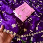 A vibrant purple moss chiffon saree featuring gold gota patti jaal work and a scalloped cutwork border.