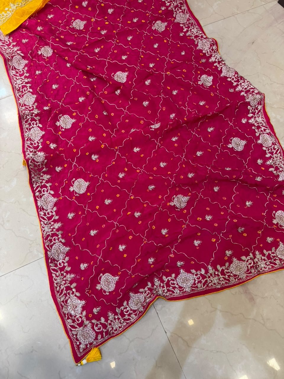 Pure Ho Silk Hand Bandhani Saree with Heavy Embroidery 4 A collection of beautiful Pure Ho silk sarees in vibrant colors featuring hand Bandhani work and intricate heavy embroidery.