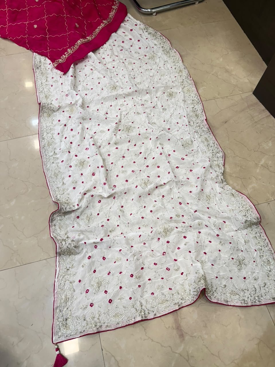 Pure Ho Silk Hand Bandhani Saree with Heavy Embroidery 5 A collection of beautiful Pure Ho silk sarees in vibrant colors featuring hand Bandhani work and intricate heavy embroidery.