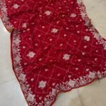 A collection of beautiful Pure Ho silk sarees in vibrant colors featuring hand Bandhani work and intricate heavy embroidery.