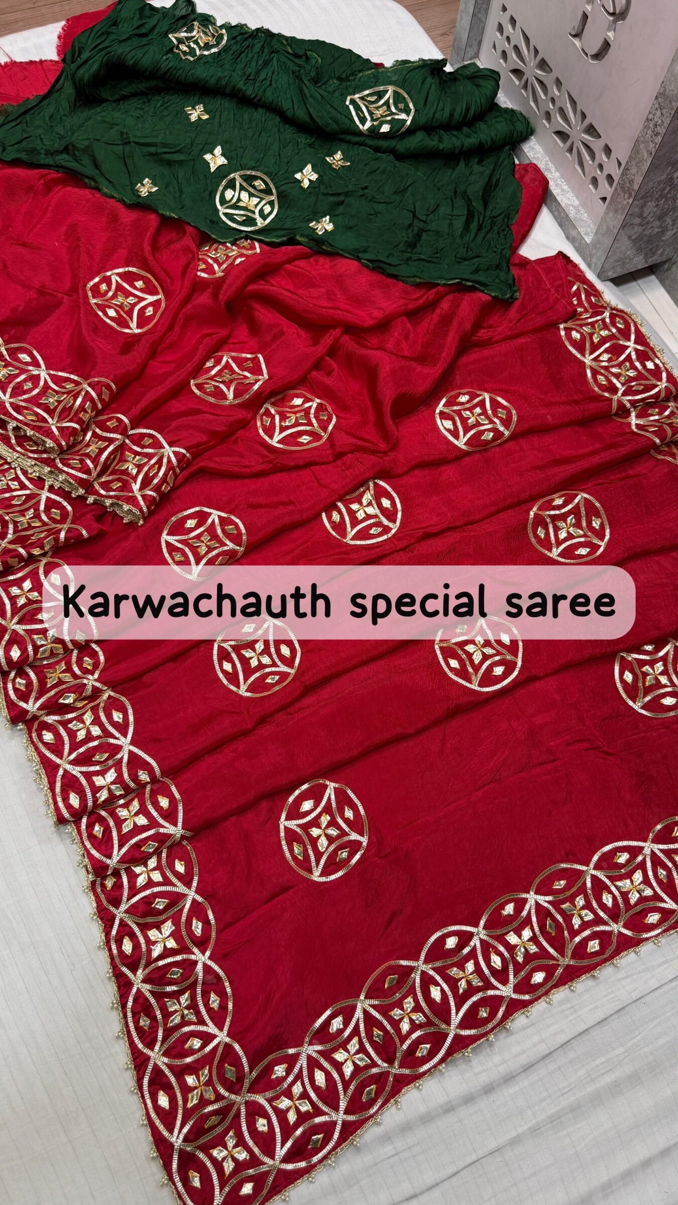 Super Duper Karwachauth Special HO Silk Gota Patti Saree 2 A beautiful red Karwachauth special saree with intricate green and gold Kachhi Gota Patti work, paired with matching bangles and a Kamar satka.
