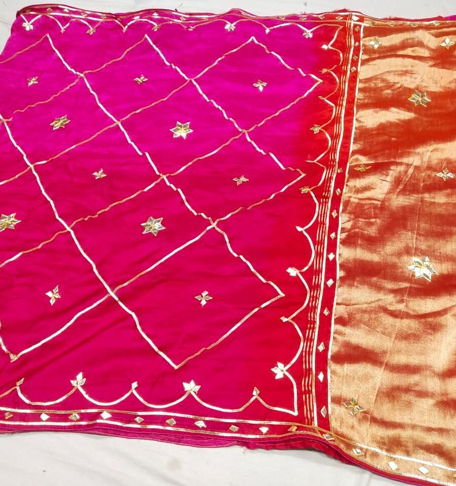 A vibrant pink and orange Jaipuri silk saree with gold gota patti diamond patterns and a rich golden border.