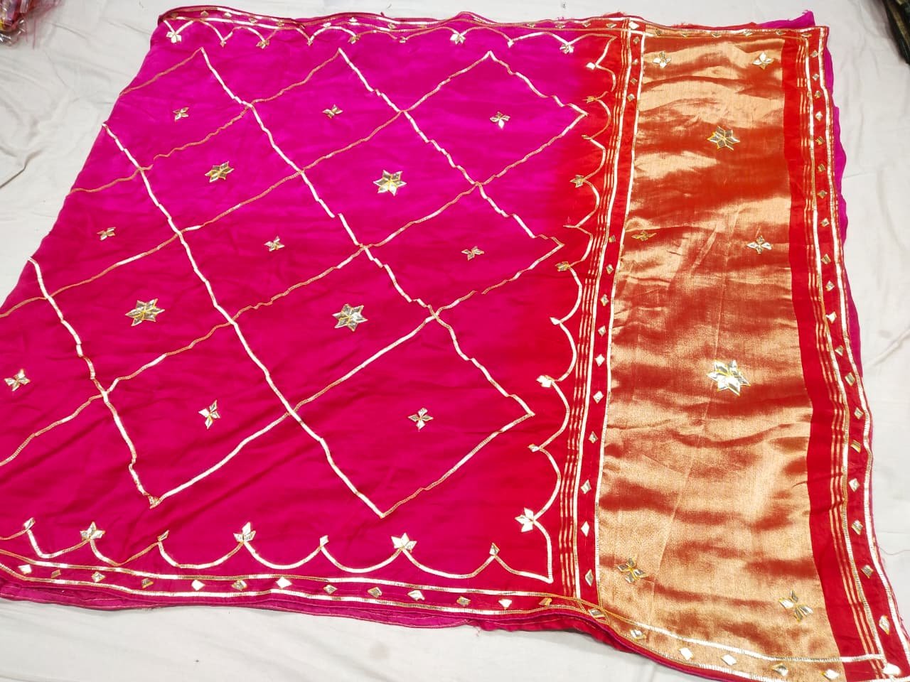 Jaipuri Gota Patti Saree in Pure Rasiyan Silk 2 A vibrant pink and orange Jaipuri silk saree with gold gota patti diamond patterns and a rich golden border.