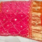 A vibrant pink and orange Jaipuri silk saree with gold gota patti diamond patterns and a rich golden border.