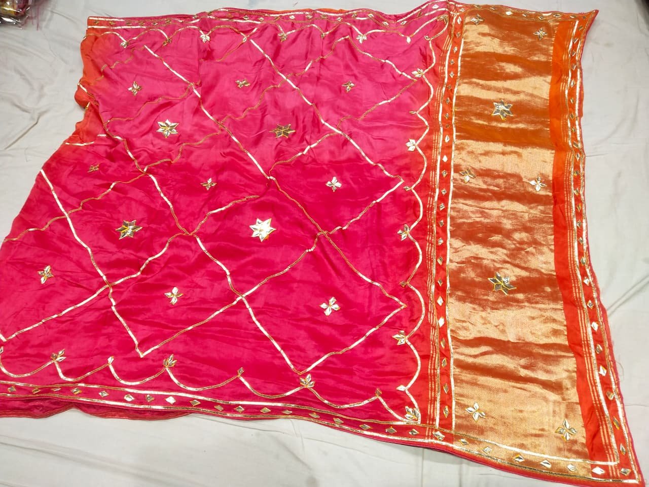 Jaipuri Gota Patti Saree in Pure Rasiyan Silk 3 A vibrant pink and orange Jaipuri silk saree with gold gota patti diamond patterns and a rich golden border.