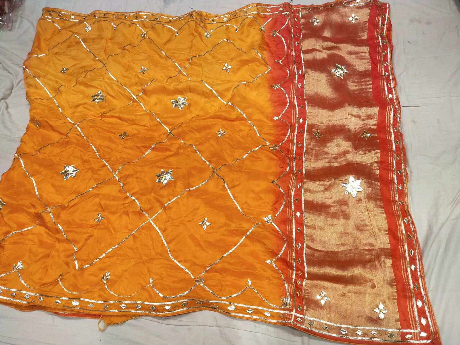 Jaipuri Gota Patti Saree in Pure Rasiyan Silk 5 A vibrant pink and orange Jaipuri silk saree with gold gota patti diamond patterns and a rich golden border.