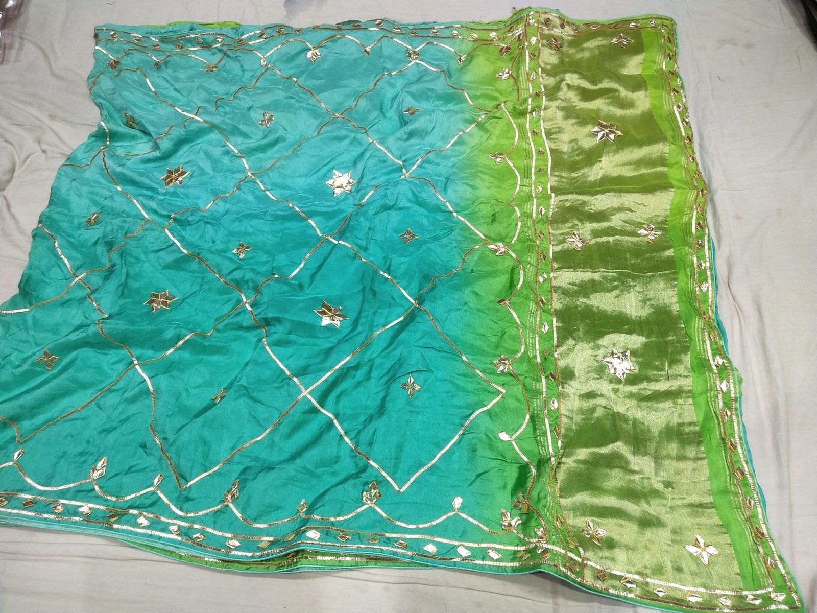 Jaipuri Gota Patti Saree in Pure Rasiyan Silk 8 A vibrant pink and orange Jaipuri silk saree with gold gota patti diamond patterns and a rich golden border.