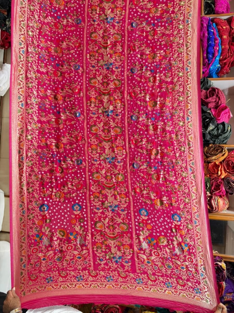 New Arrivals 42 A beautiful deep pink pure Khadi Silk saree featuring intricate Bandhej patterns and detailed gold Neemjari border work.