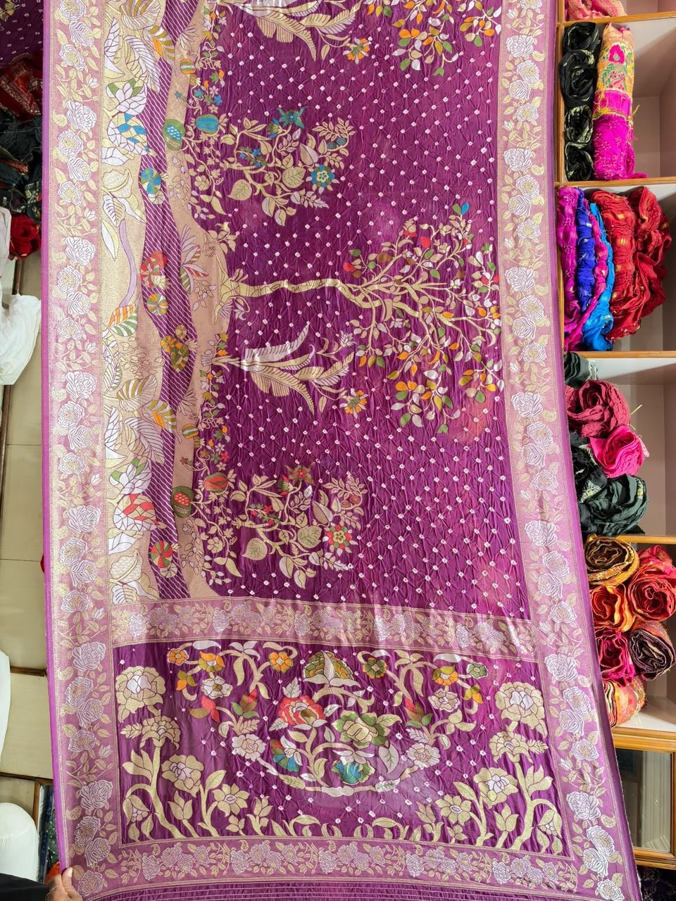 Pure Handloom Khadi Silk Neemjari Bandhej Saree 2 A beautiful deep pink pure Khadi Silk saree featuring intricate Bandhej patterns and detailed gold Neemjari border work.