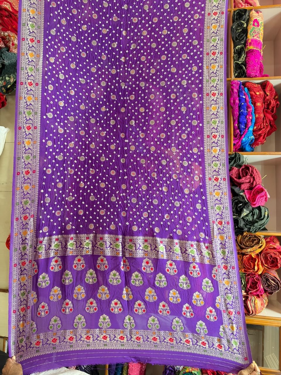 Pure Handloom Khadi Silk Neemjari Bandhej Saree 3 A beautiful deep pink pure Khadi Silk saree featuring intricate Bandhej patterns and detailed gold Neemjari border work.