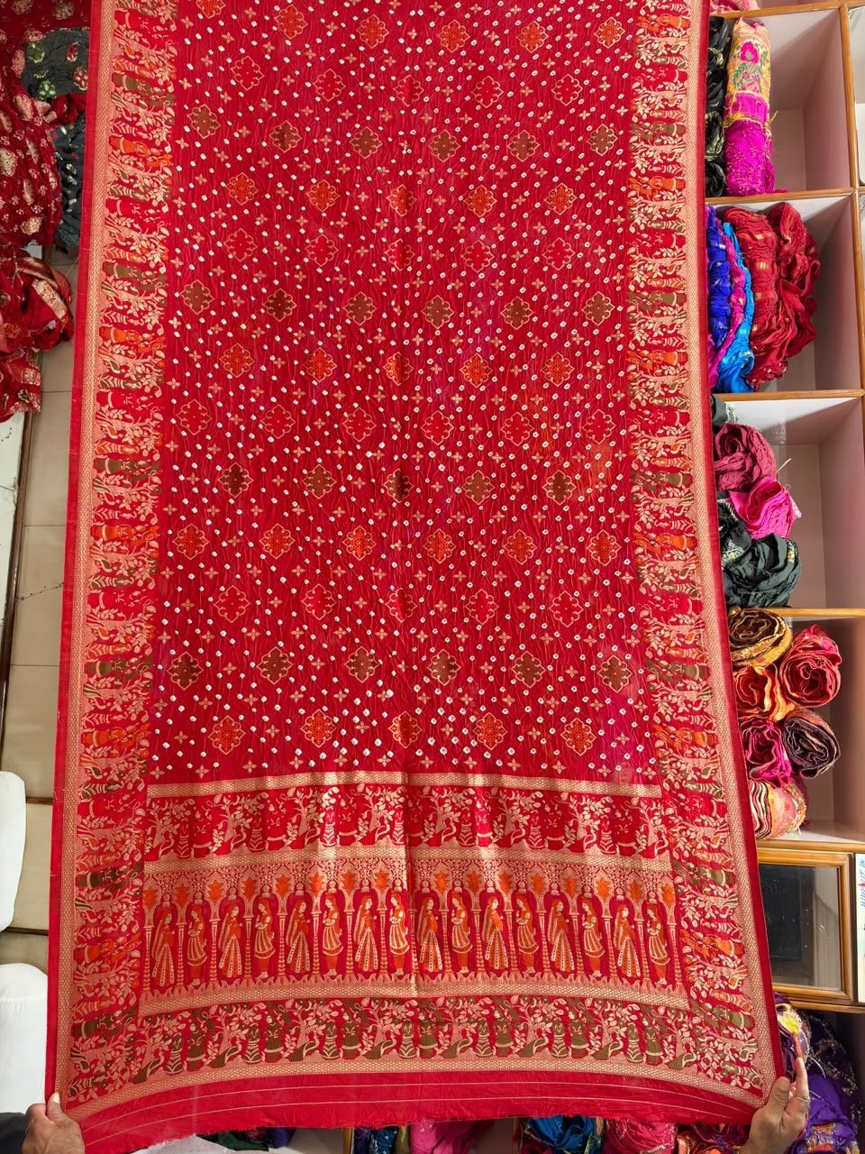 Pure Handloom Khadi Silk Neemjari Bandhej Saree 5 A beautiful deep pink pure Khadi Silk saree featuring intricate Bandhej patterns and detailed gold Neemjari border work.