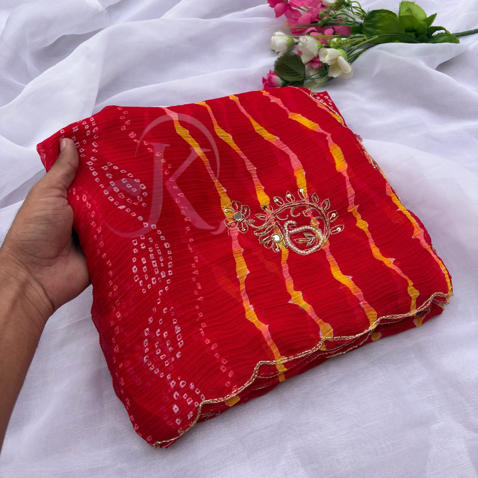 Designer Leheriya Chiffon Saree with Handwork 9 A collage showing six vibrant Leheriya print sarees in different colors with detailed hand-embroidered borders and work.