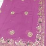 A bright yellow pure 30g Georgette saree with aari machine work and mirror embellishments along the border and fabric.