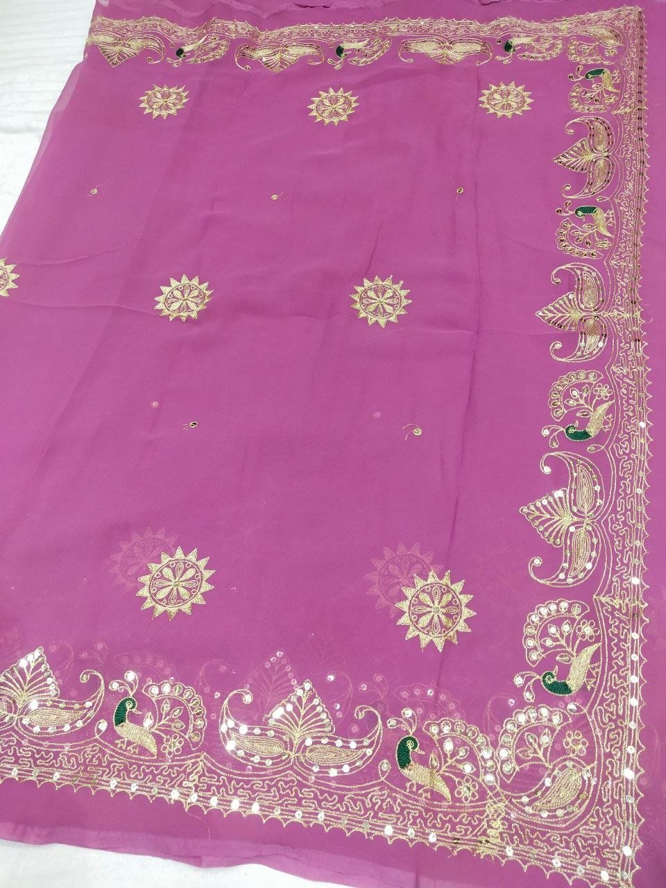 Mirror Work Saree in Pure Georgette with Aari Machine Work 9 A bright yellow pure 30g Georgette saree with aari machine work and mirror embellishments along the border and fabric.