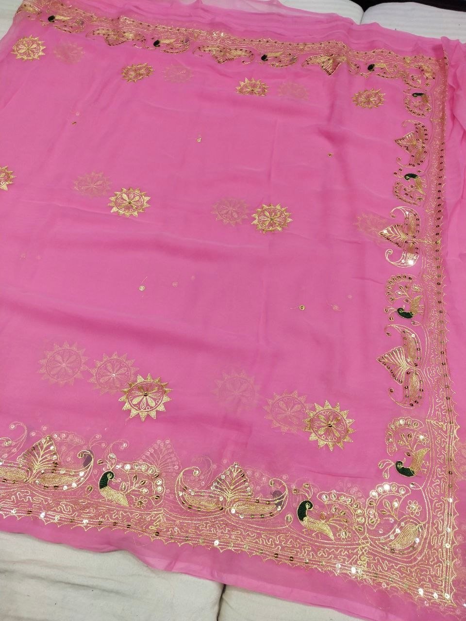 Mirror Work Saree in Pure Georgette with Aari Machine Work 4 A bright yellow pure 30g Georgette saree with aari machine work and mirror embellishments along the border and fabric.