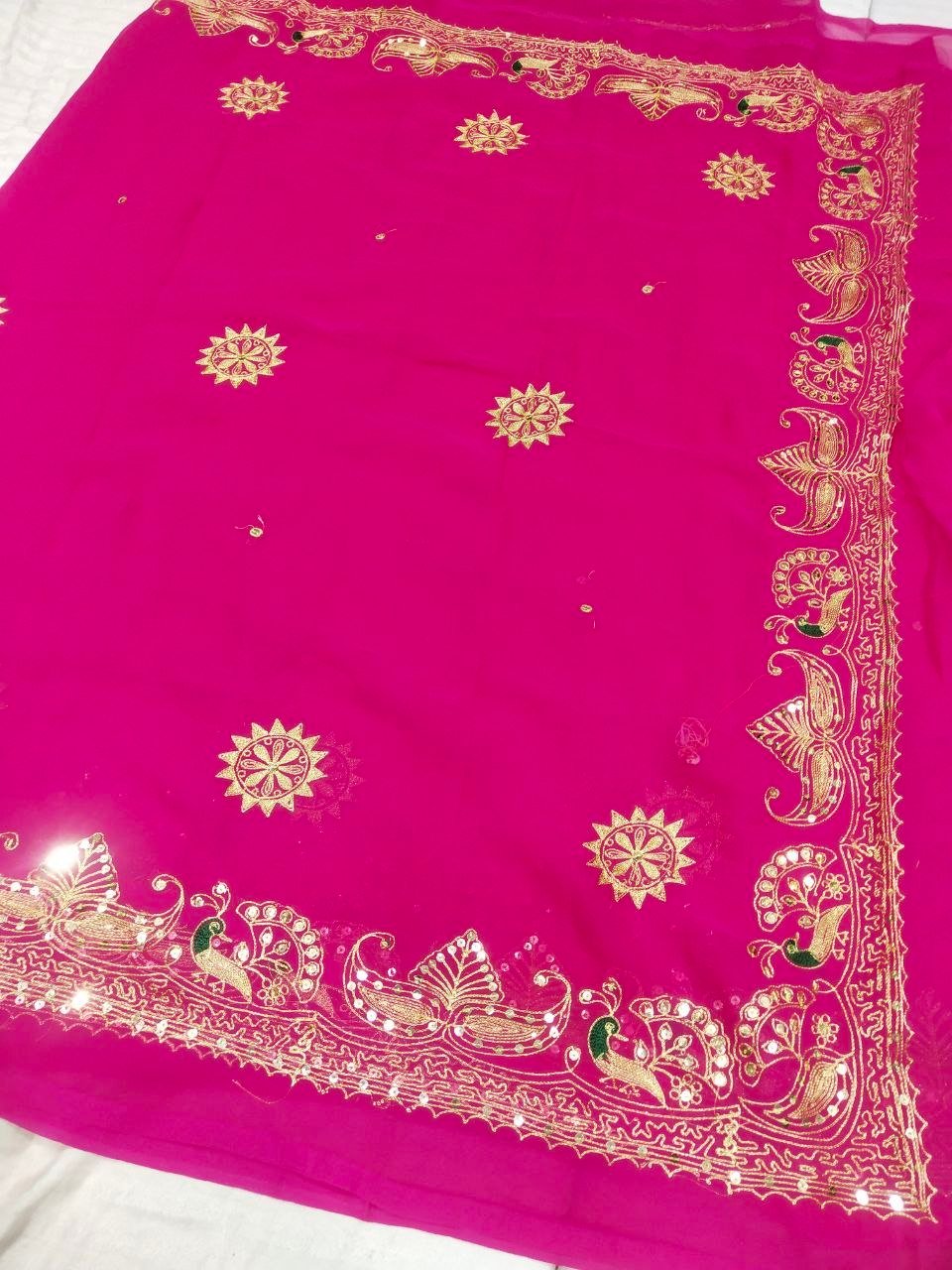 Mirror Work Saree in Pure Georgette with Aari Machine Work 6 A bright yellow pure 30g Georgette saree with aari machine work and mirror embellishments along the border and fabric.