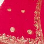 A bright yellow pure 30g Georgette saree with aari machine work and mirror embellishments along the border and fabric.