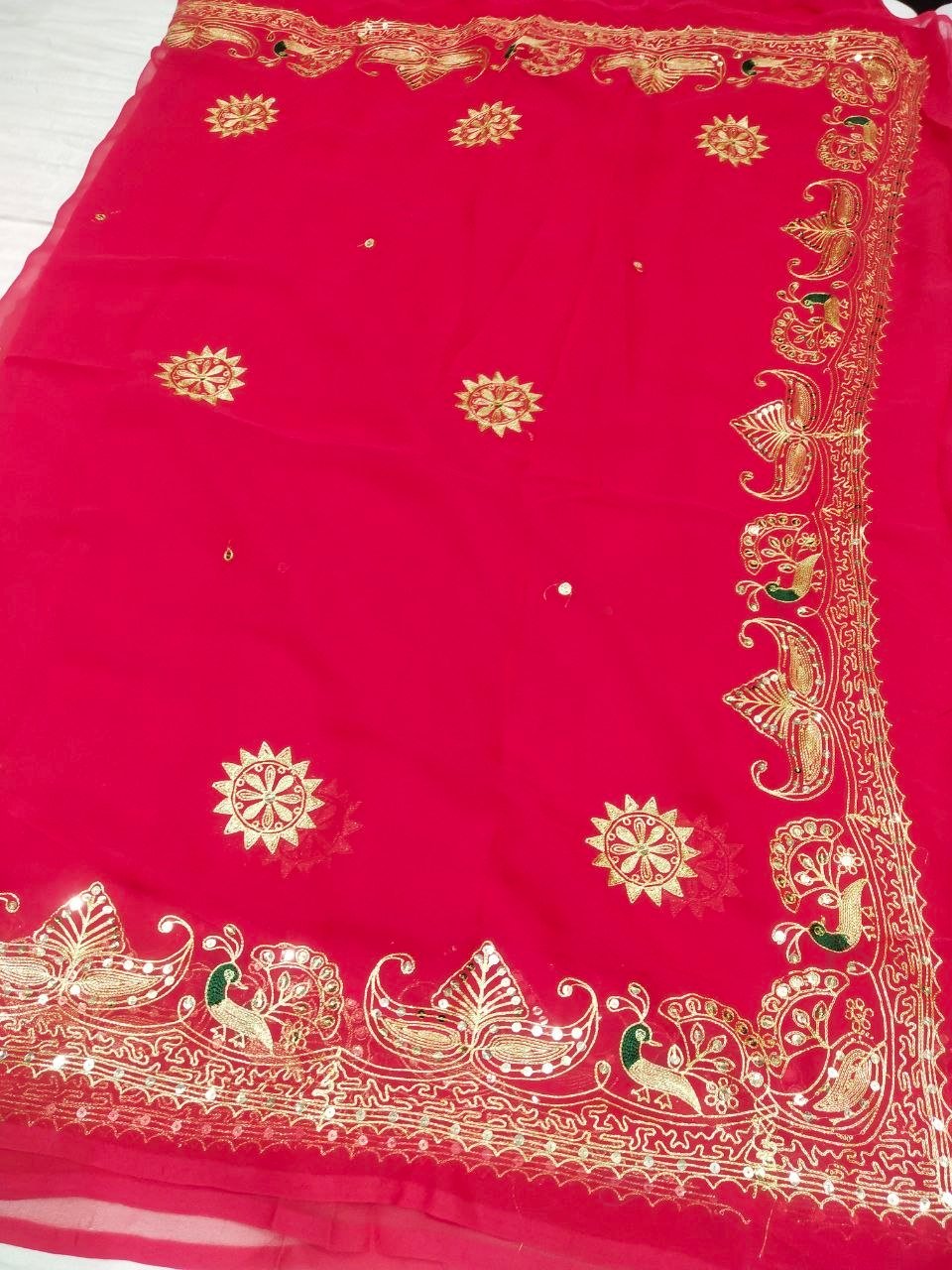 Mirror Work Saree in Pure Georgette with Aari Machine Work 7 A bright yellow pure 30g Georgette saree with aari machine work and mirror embellishments along the border and fabric.
