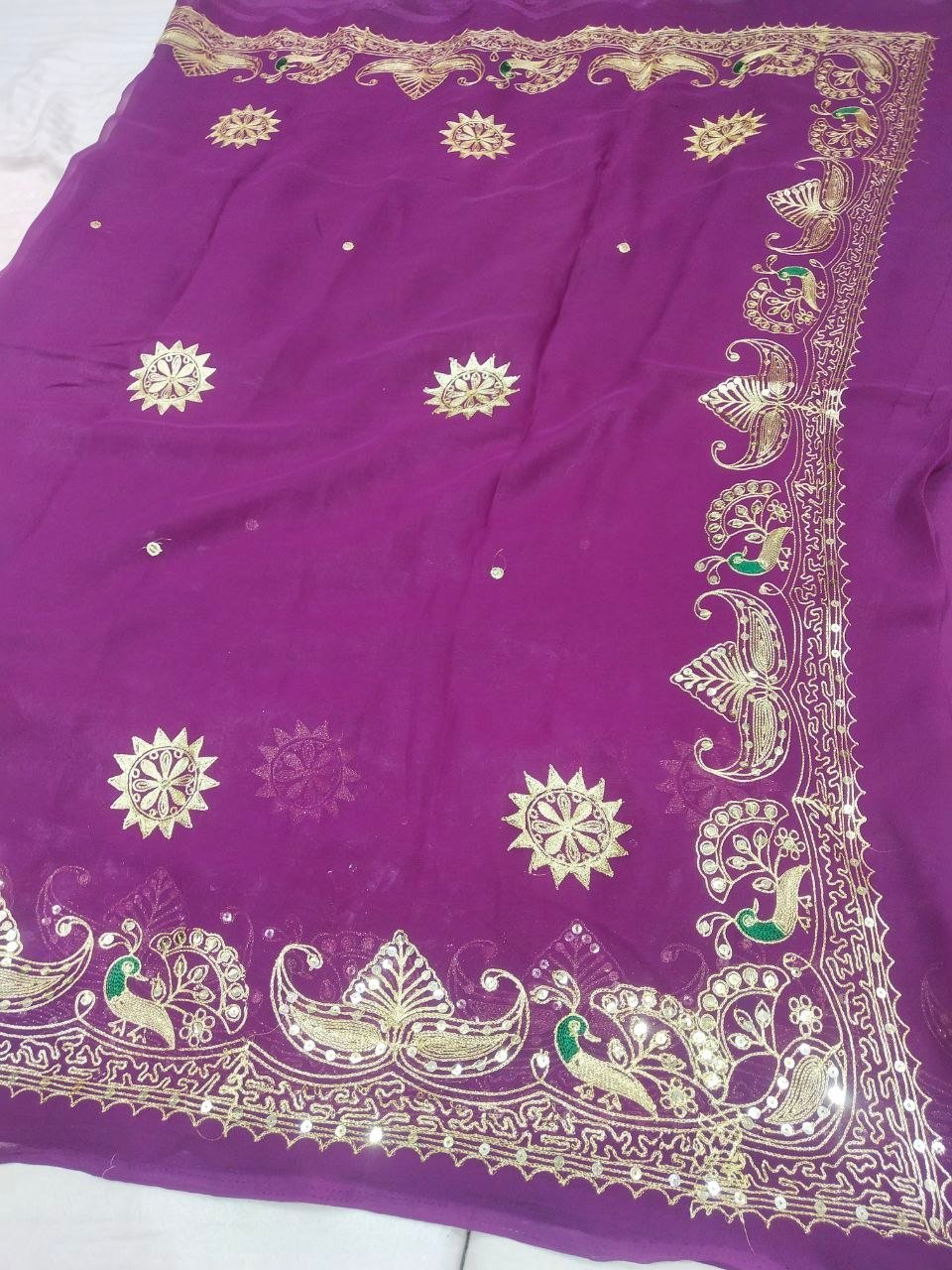 Mirror Work Saree in Pure Georgette with Aari Machine Work 8 A bright yellow pure 30g Georgette saree with aari machine work and mirror embellishments along the border and fabric.