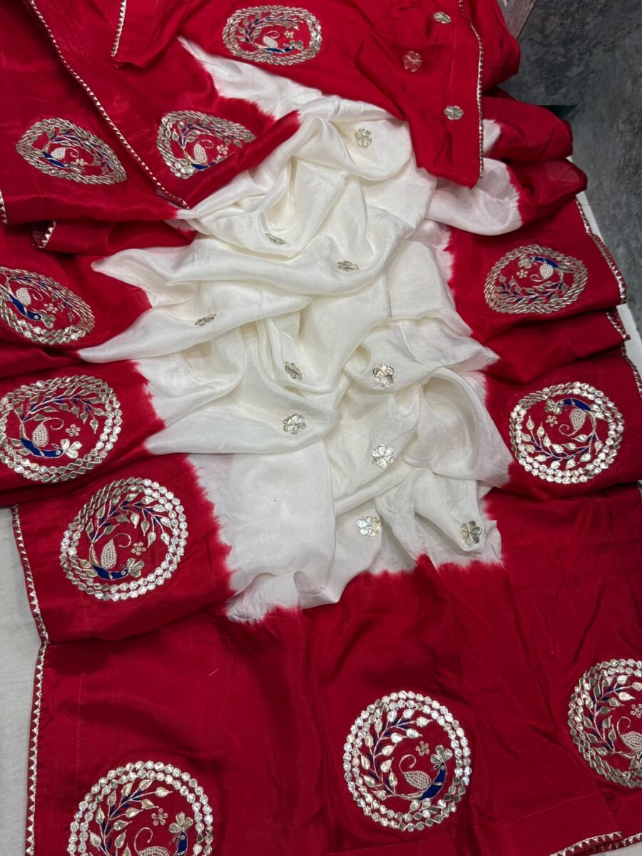 A beautiful red and white Pure HO silk saree displayed with heavy Gota Patti peacock embroidery.