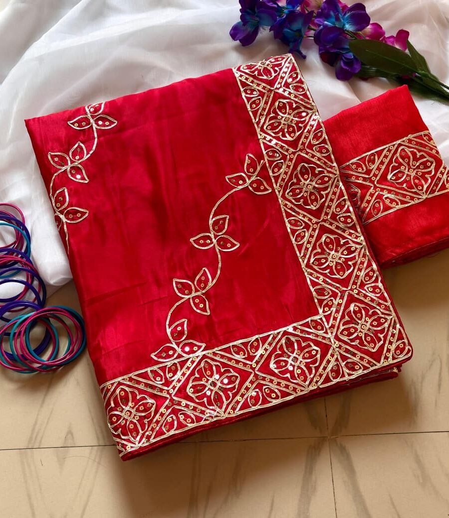 A beautiful red Pure Ho Silk saree featuring intricate golden Gota Patti and sequence embroidery with matching bangles.