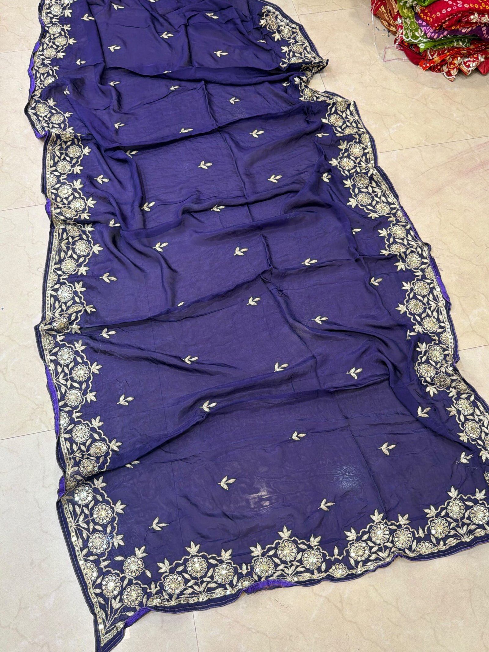 Pure Ho Silk Saree with Elegant Handwork | Kanha Saree 2 A beautiful purple Pure Ho silk saree adorned with delicate gold handwork embroidery along the borders and on the body.