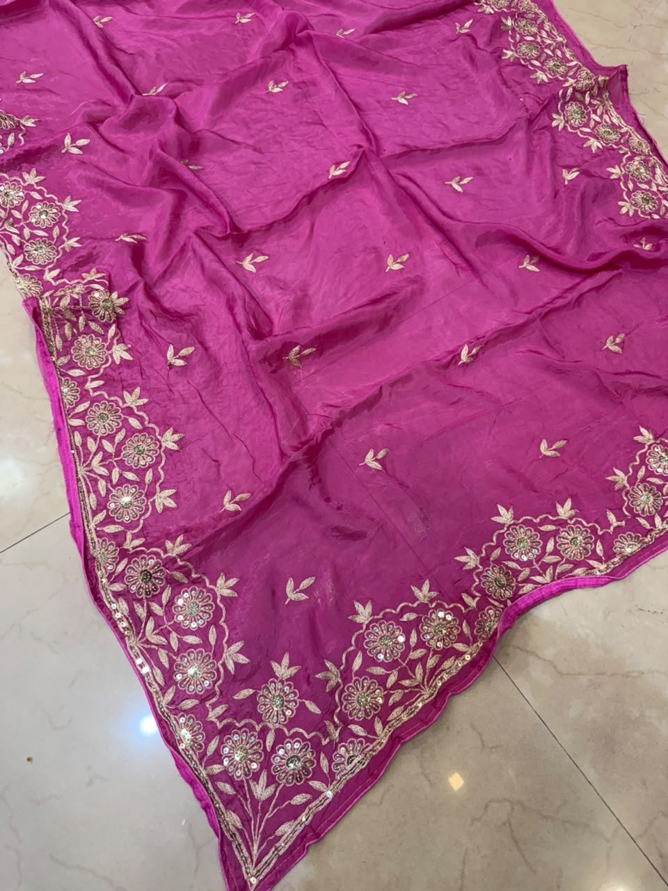 Pure Ho Silk Saree with Elegant Handwork | Kanha Saree 6 A beautiful purple Pure Ho silk saree adorned with delicate gold handwork embroidery along the borders and on the body.