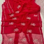 A vibrant red Royal Georgette saree featuring delicate floral handwork embroidery and a detailed border.