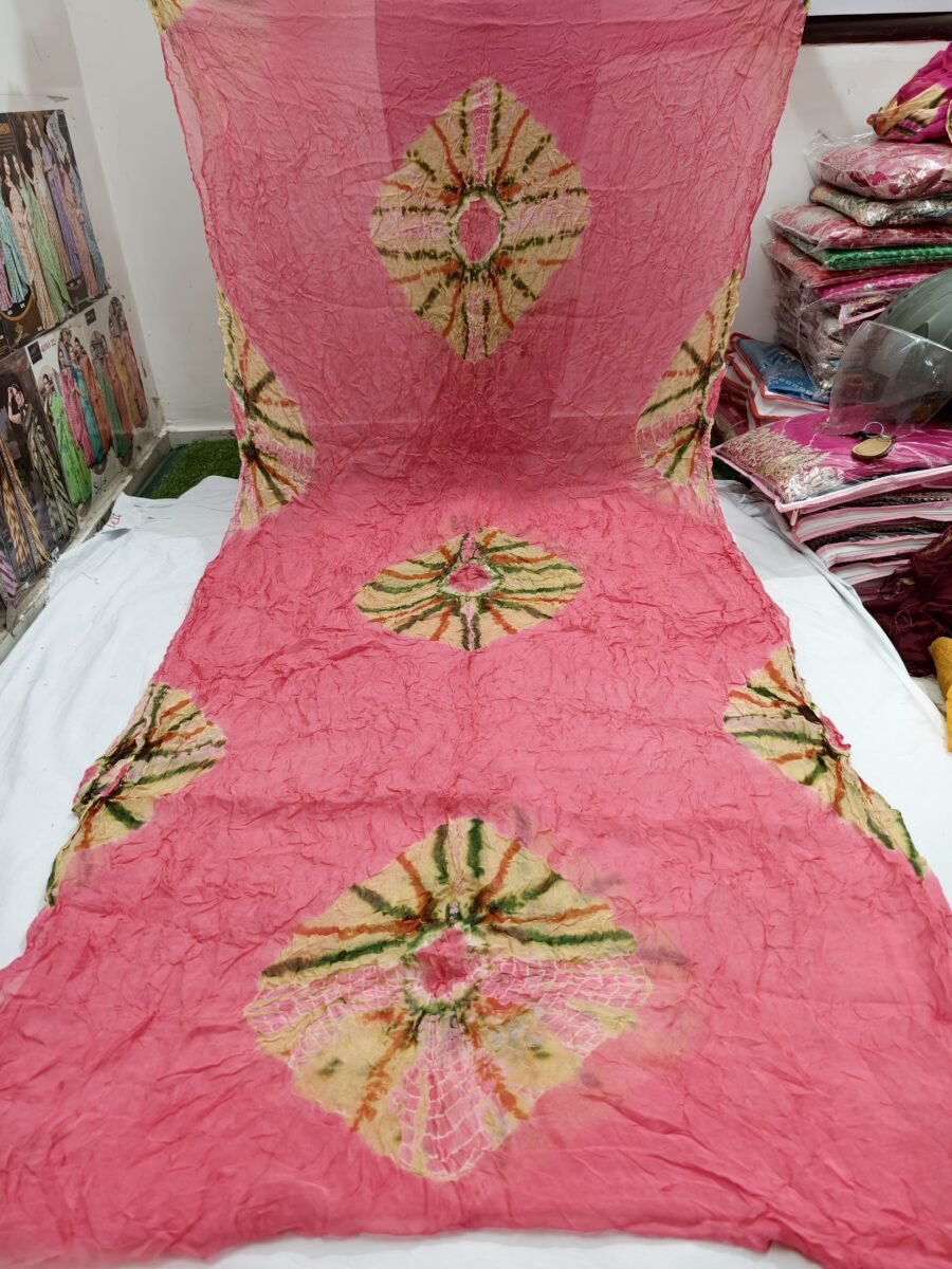 New Arrivals 52 A beautiful pink Tora silk Bandhani saree with traditional circular tie-dye patterns spread across the fabric.