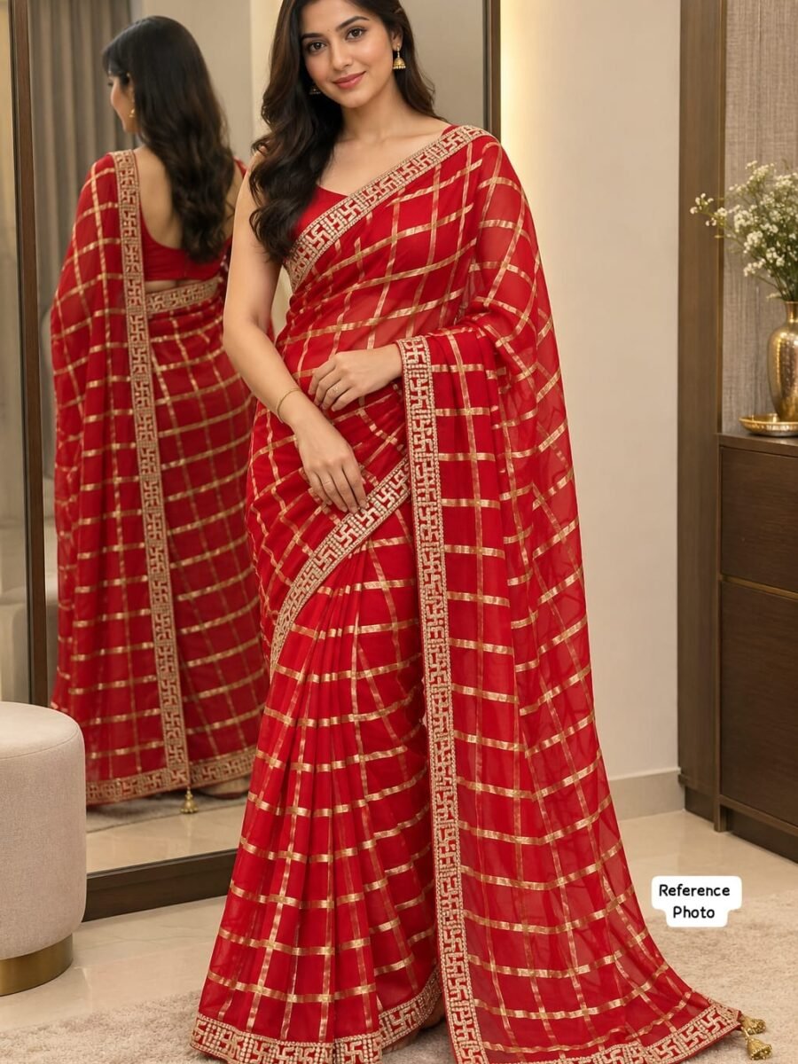 New Arrivals 30 A beautiful woman posing in a red Viscose Chokda saree featuring a grid pattern and detailed embroidery border.