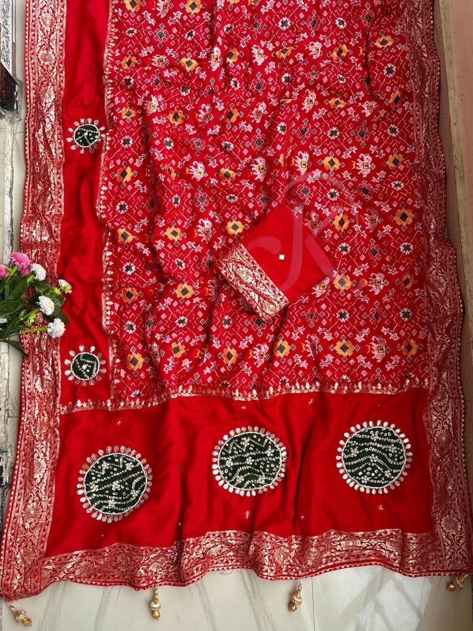 Traditional Viscose Dolla Patola Saree - Karwa Chauth Special 3 A collection of beautiful Viscose Dolla Patola sarees in vibrant colours with traditional handwork and fancy latkans displayed on a textured background.
