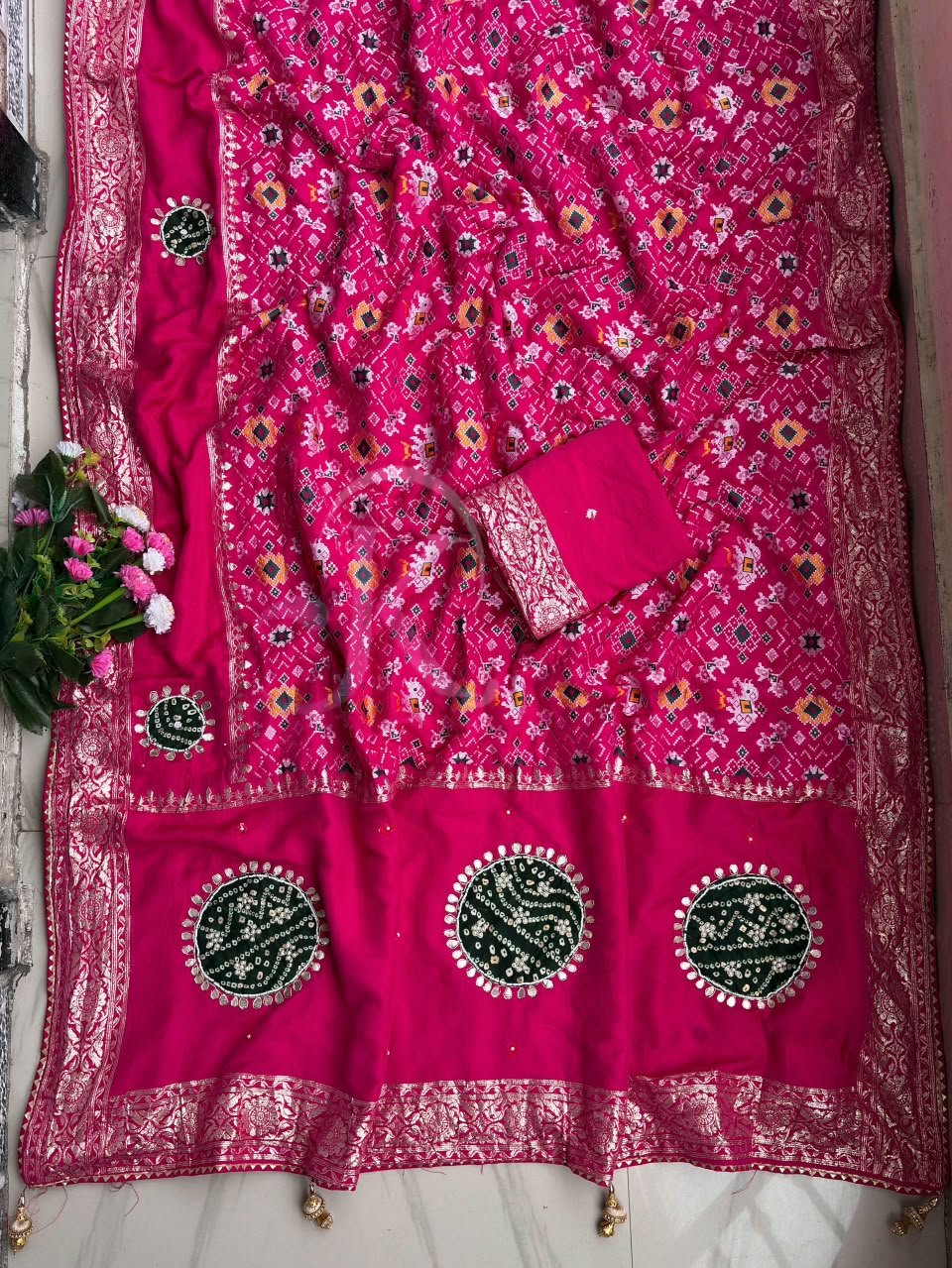 Traditional Viscose Dolla Patola Saree - Karwa Chauth Special 4 A collection of beautiful Viscose Dolla Patola sarees in vibrant colours with traditional handwork and fancy latkans displayed on a textured background.