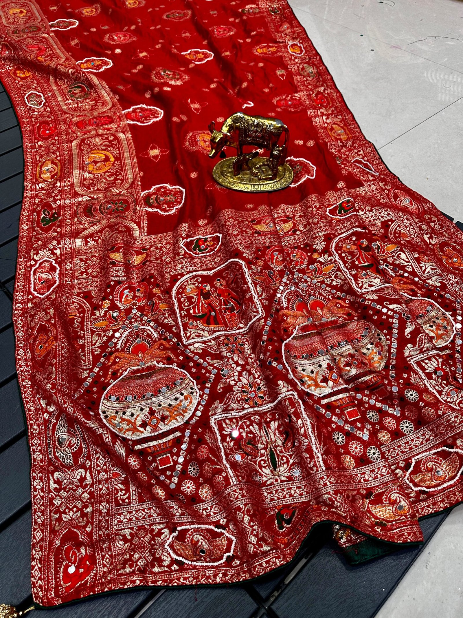 Traditional Viscose Dolla Patola Saree - Karwa Chauth Special 7 A collection of beautiful Viscose Dolla Patola sarees in vibrant colours with traditional handwork and fancy latkans displayed on a textured background.