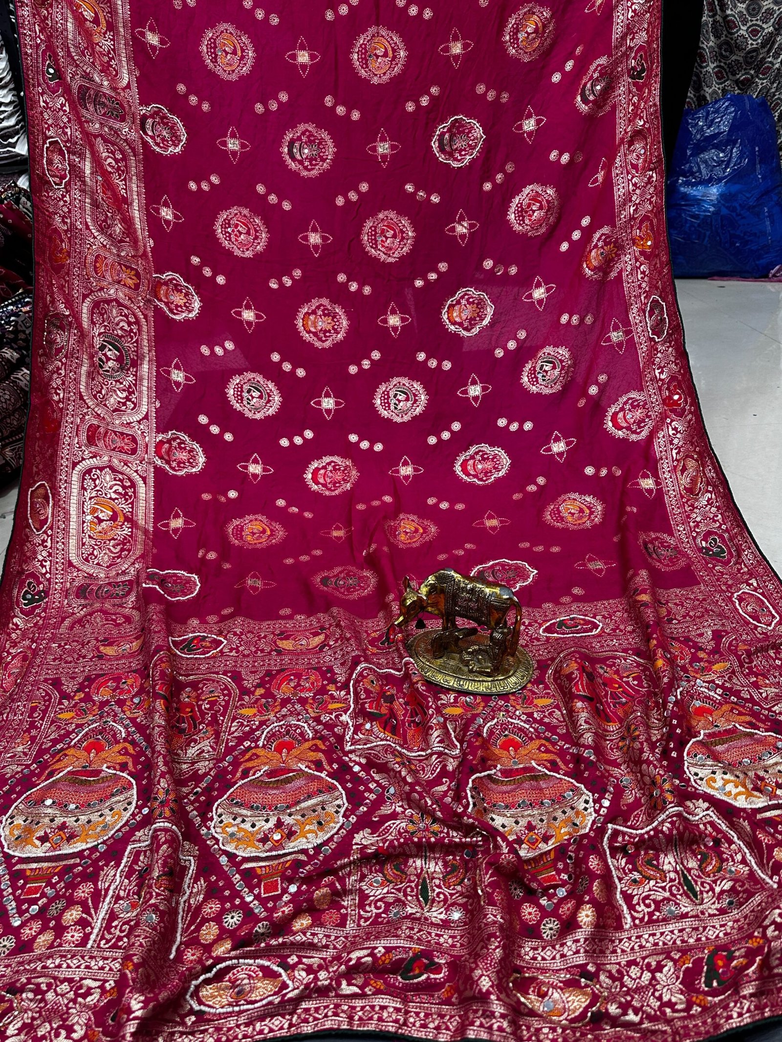 Traditional Viscose Dolla Patola Saree - Karwa Chauth Special 8 A collection of beautiful Viscose Dolla Patola sarees in vibrant colours with traditional handwork and fancy latkans displayed on a textured background.