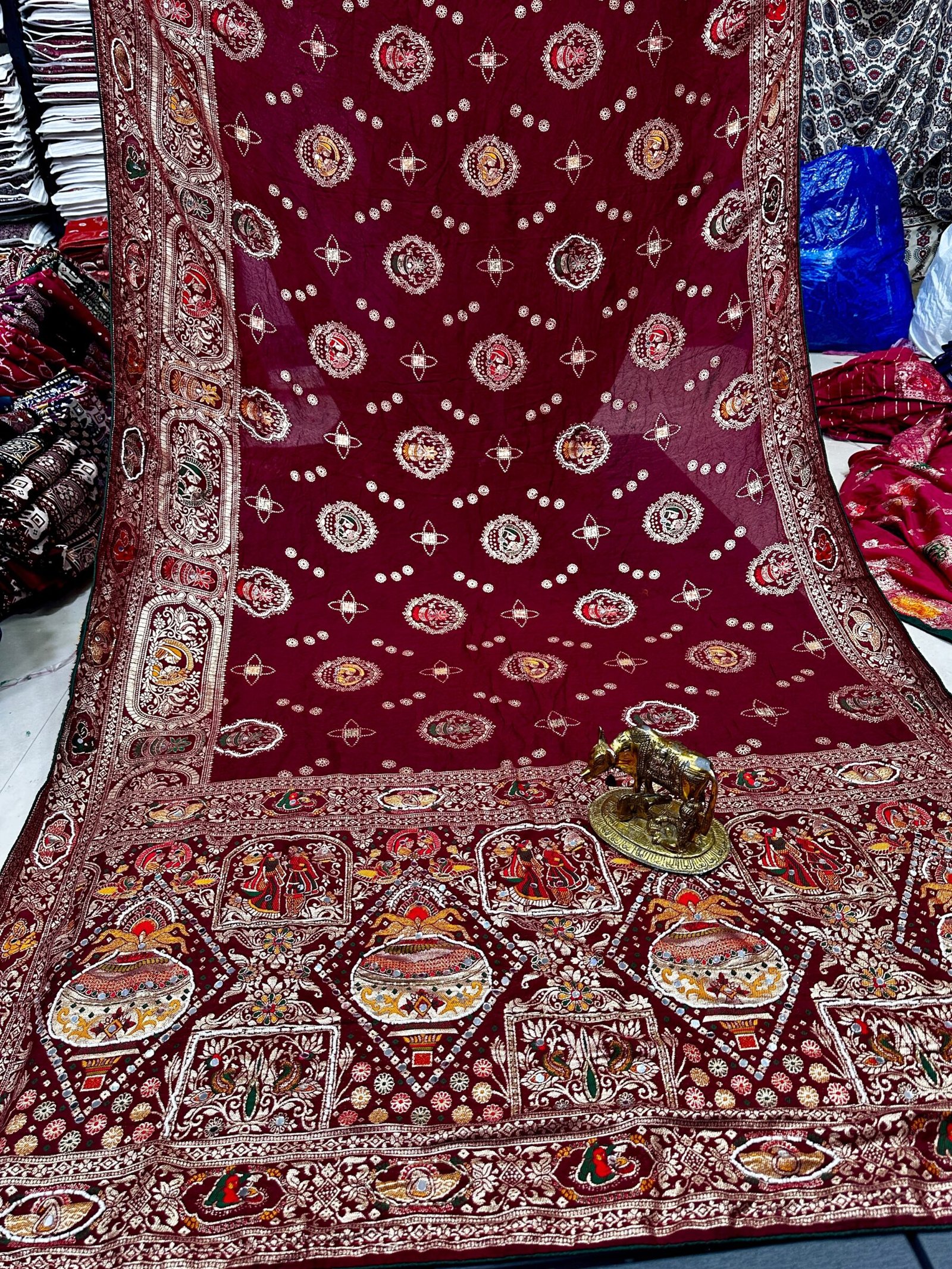 Traditional Viscose Dolla Patola Saree - Karwa Chauth Special 9 A collection of beautiful Viscose Dolla Patola sarees in vibrant colours with traditional handwork and fancy latkans displayed on a textured background.