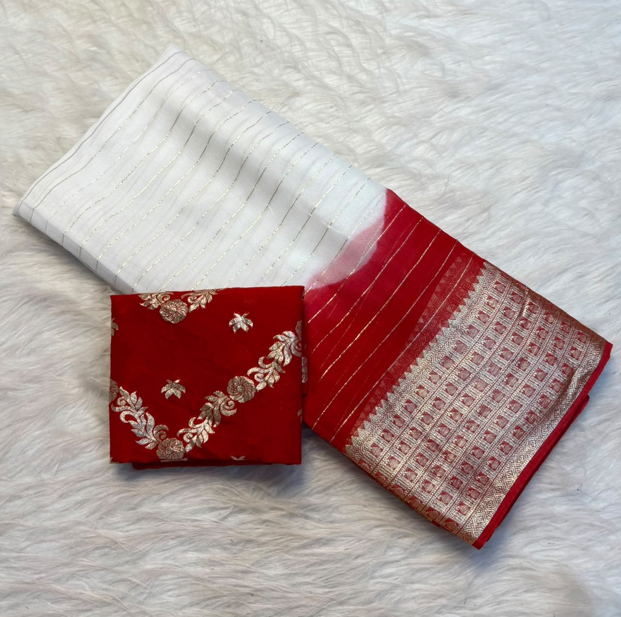 Pure Viscose Georgette Saree for Durga Pooja 4 A white and red dual-tone Pure Viscose Georgette saree with golden zari stripes and a wide traditional jacquard border, displayed with a matching red embroidered blouse.